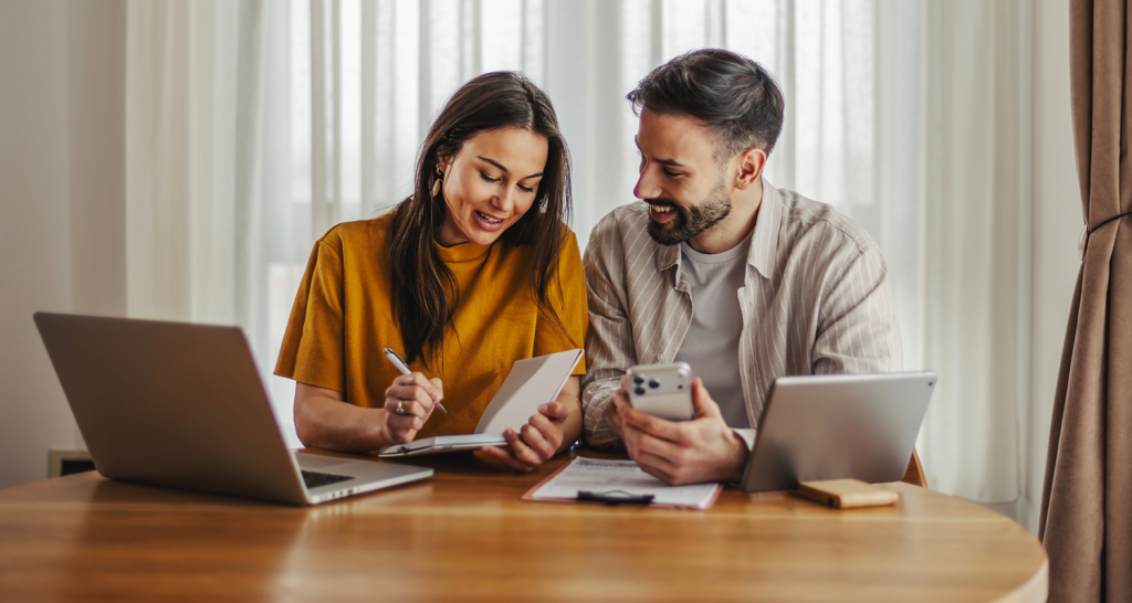 a man and woman looking at finances together